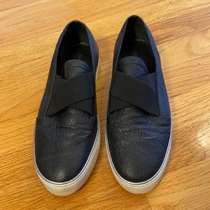 Stuart Weitzman black leather slip-on sneakers size 10